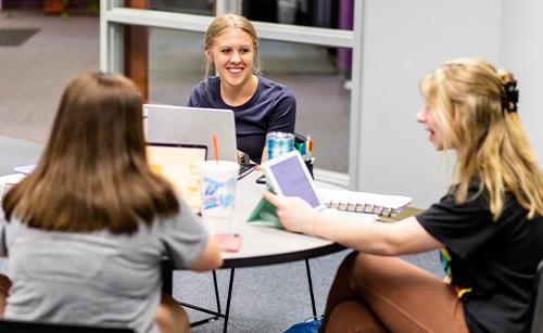 students studying on campus in study room